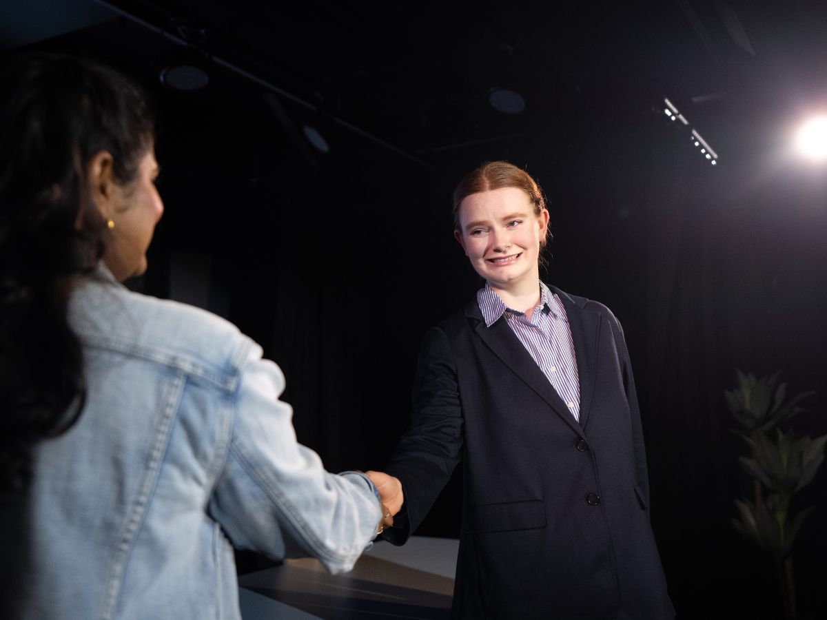 Justin handshake — production still from The Algorithm of Us